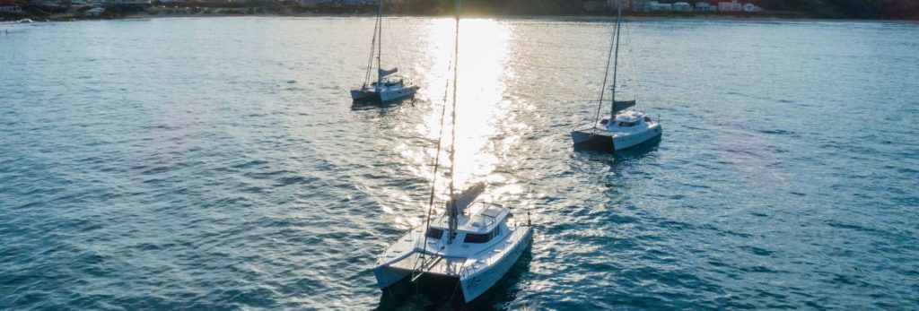 A catamaran captured navigating the ocean.