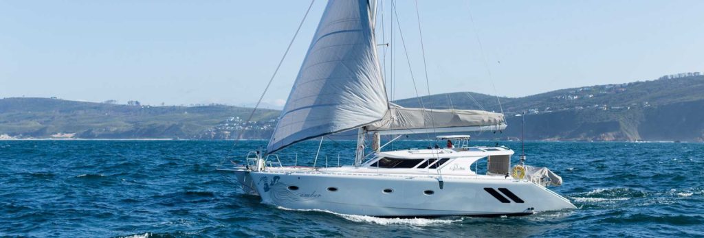 A catamaran captured on the waters travelling at a high speed