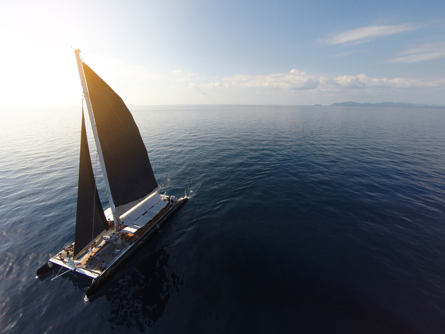 A catamaran sailing on the open seas