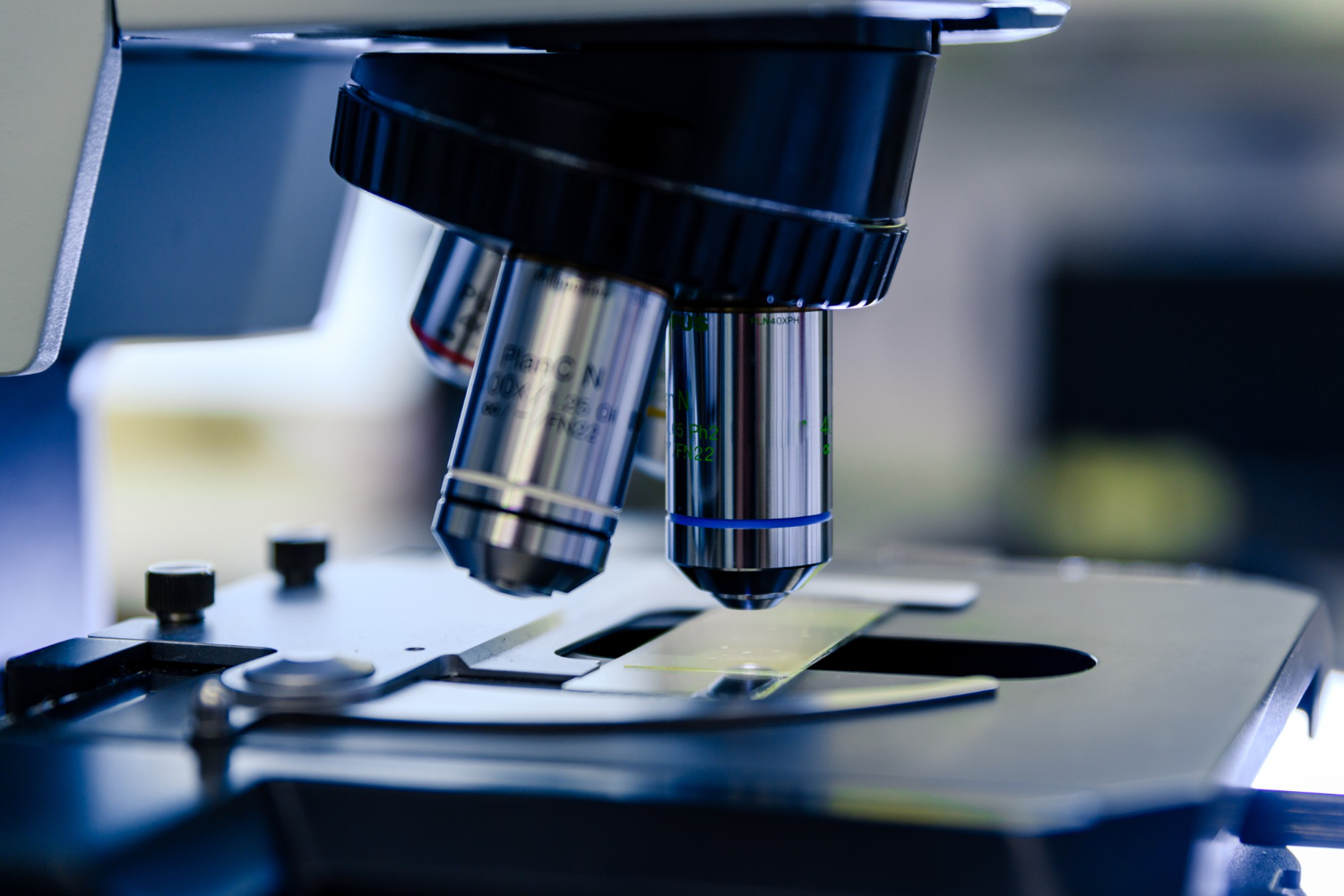 Microscope examining a sample slide, highlighting plankton harvesting and scientific curiosity within the hobbies of the catamaran community.
