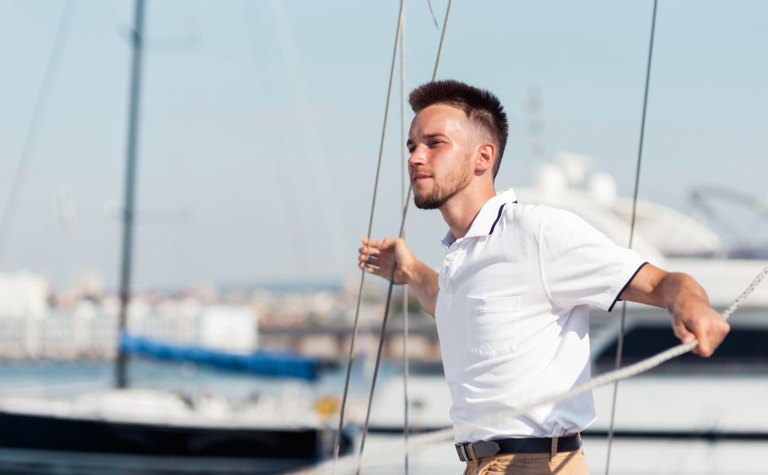 View Of A Sailor Onboard A Catamaran